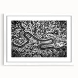 Framed landscape wall art featuring a serene road design with vibrant colors, enclosed in a sleek white mat, ideal for home decor enhancement.