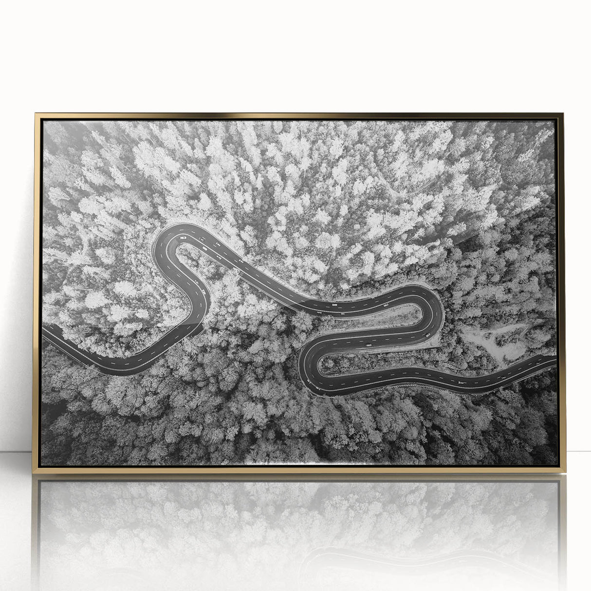 Framed acrylic wall art featuring a modern landscape design with a gold finish, showcasing a serene road through lush greenery, ideal for enhancing contemporary home decor.
