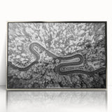 Framed acrylic wall art featuring a modern landscape design with a silver border, showcasing a serene road scene, perfect for enhancing contemporary home decor.