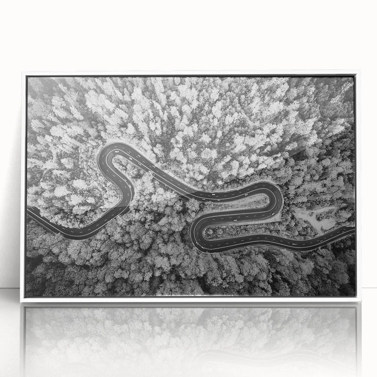 Framed acrylic wall art showcasing a serene landscape with winding roads, set against a bright white background, perfect for modern home decor.