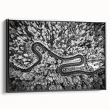 Framed canvas wall art showcasing a scenic landscape with winding roads, featuring a black frame and side view, ideal for modern home décor.