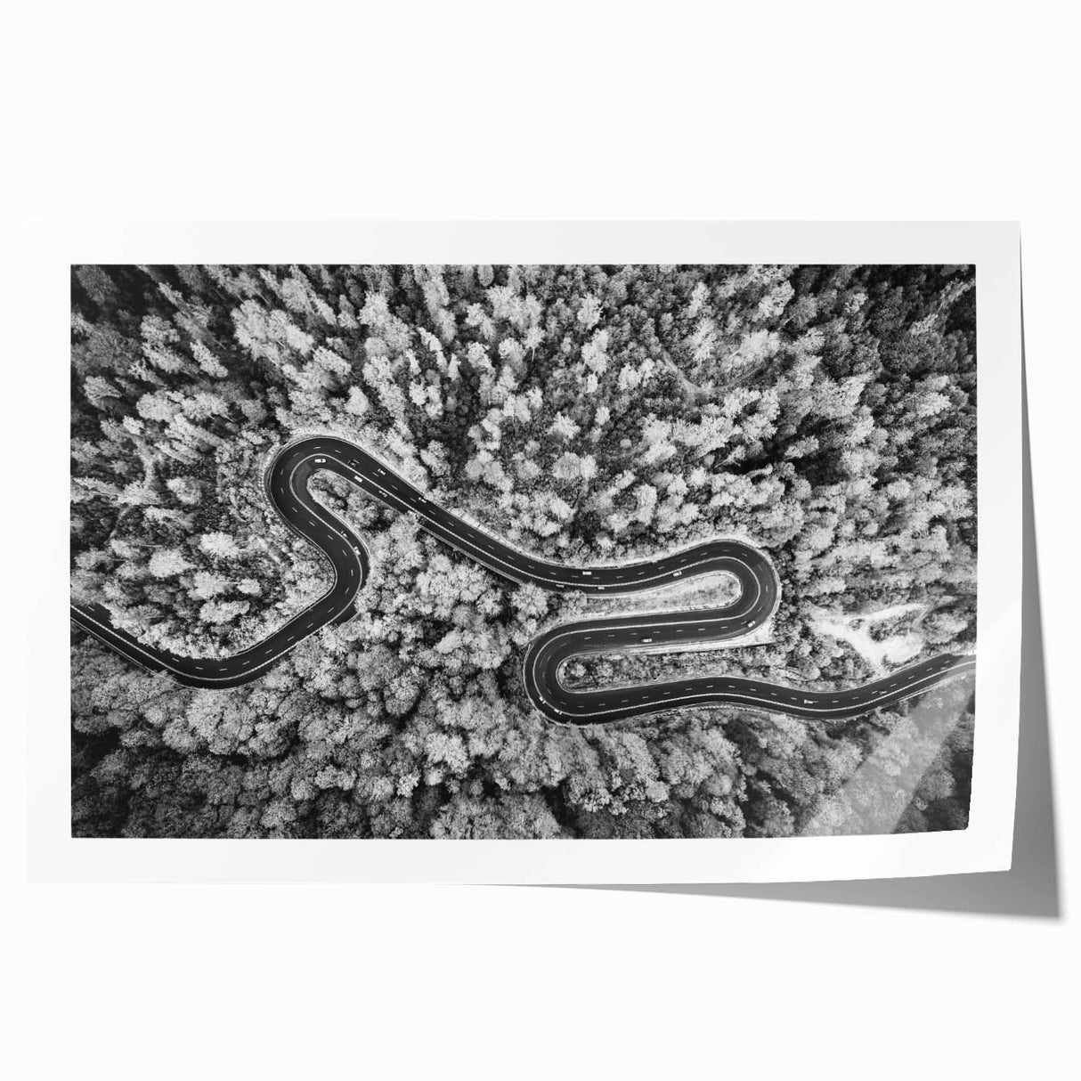 Vibrant rolled wall art print showcasing an abstract landscape design with winding roads and a colorful sky, ideal for modern home decor or office spaces.