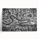 Stretched canvas artwork showcasing a vibrant landscape and road design, perfect for home decor. The colorful piece leans against a neutral wall, enhancing any interior setting.