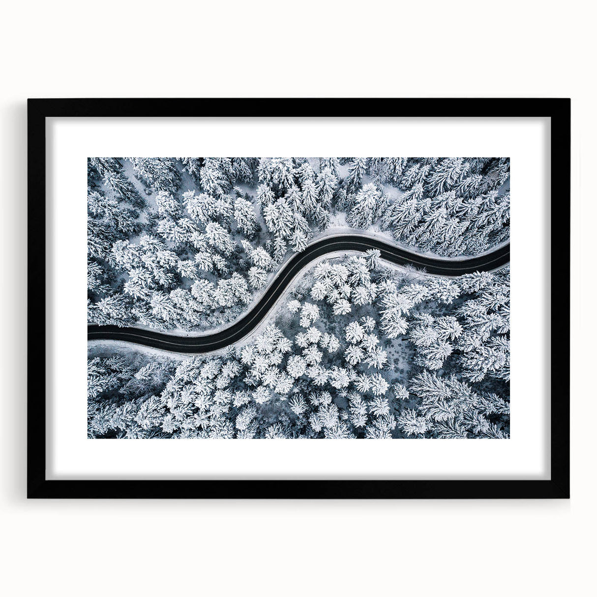 Framed wall art featuring a stunning landscape with winding roads, set in a sleek black frame with a white mat, ideal for modern home decor. Perfect for adding a touch of elegance to any room.
