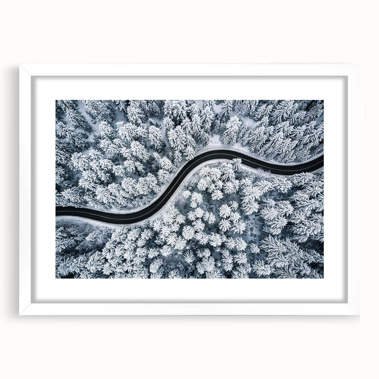 White-framed wall art showcasing a scenic landscape design with winding roads and lush greenery, perfect for enhancing home decor and creating a tranquil atmosphere.