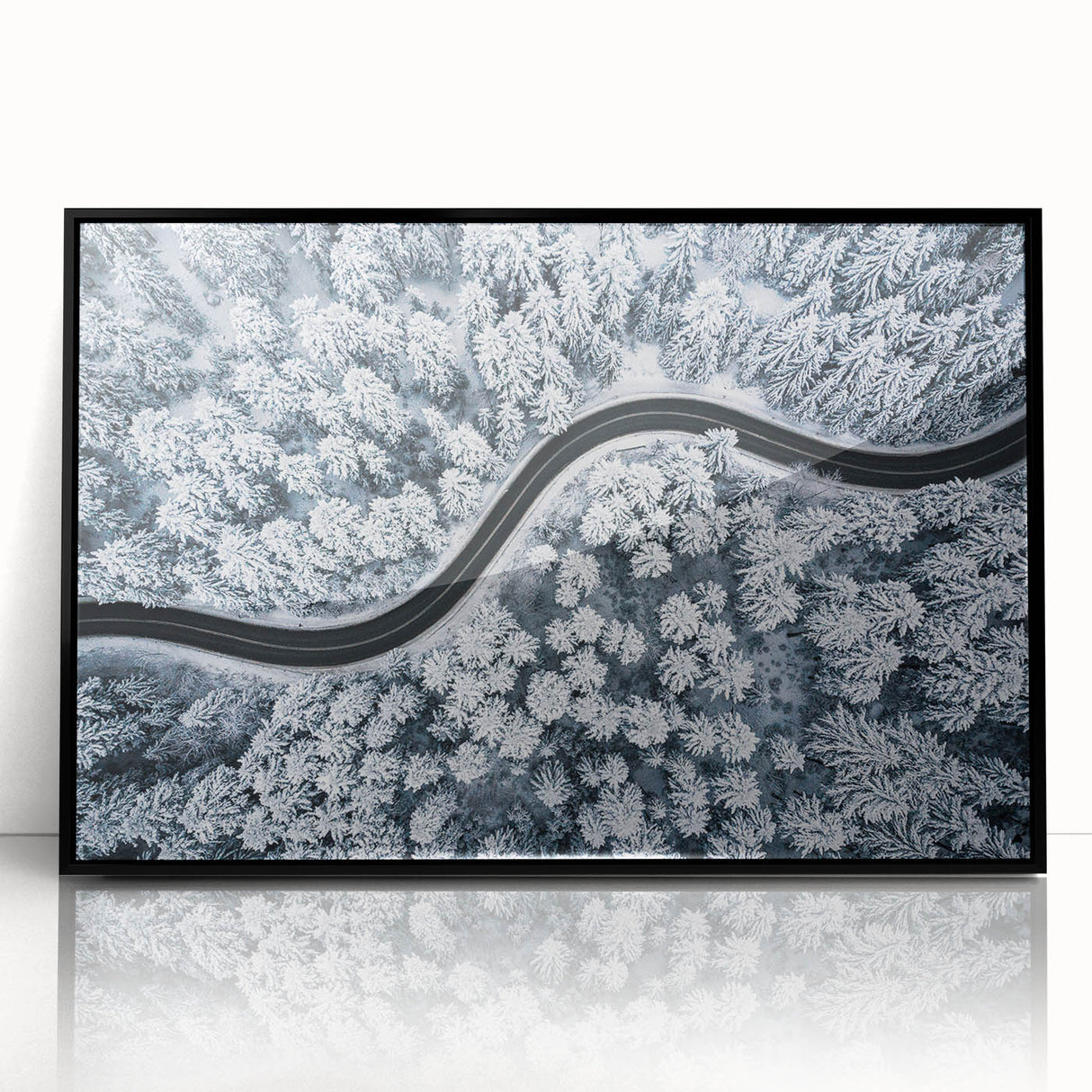 Framed wall art collection showcasing a scenic landscape design featuring winding roads and lush greenery, presented in a sleek black frame for modern decor.