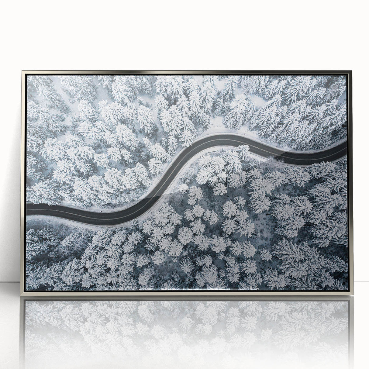 Framed wall art featuring a modern landscape design with an intricate road scene, highlighted by silver acrylic framing, perfect for contemporary home decor.