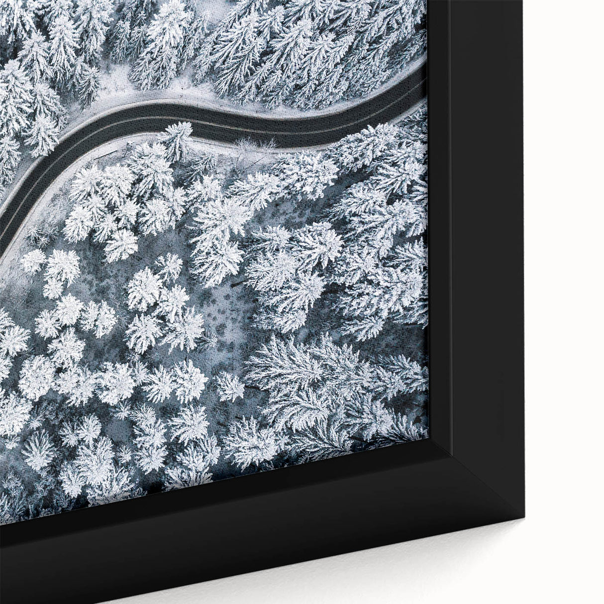 Close-up of a framed canvas artwork showcasing a vibrant, abstract landscape with winding roads and rich earthy tones, perfect for modern home decor.