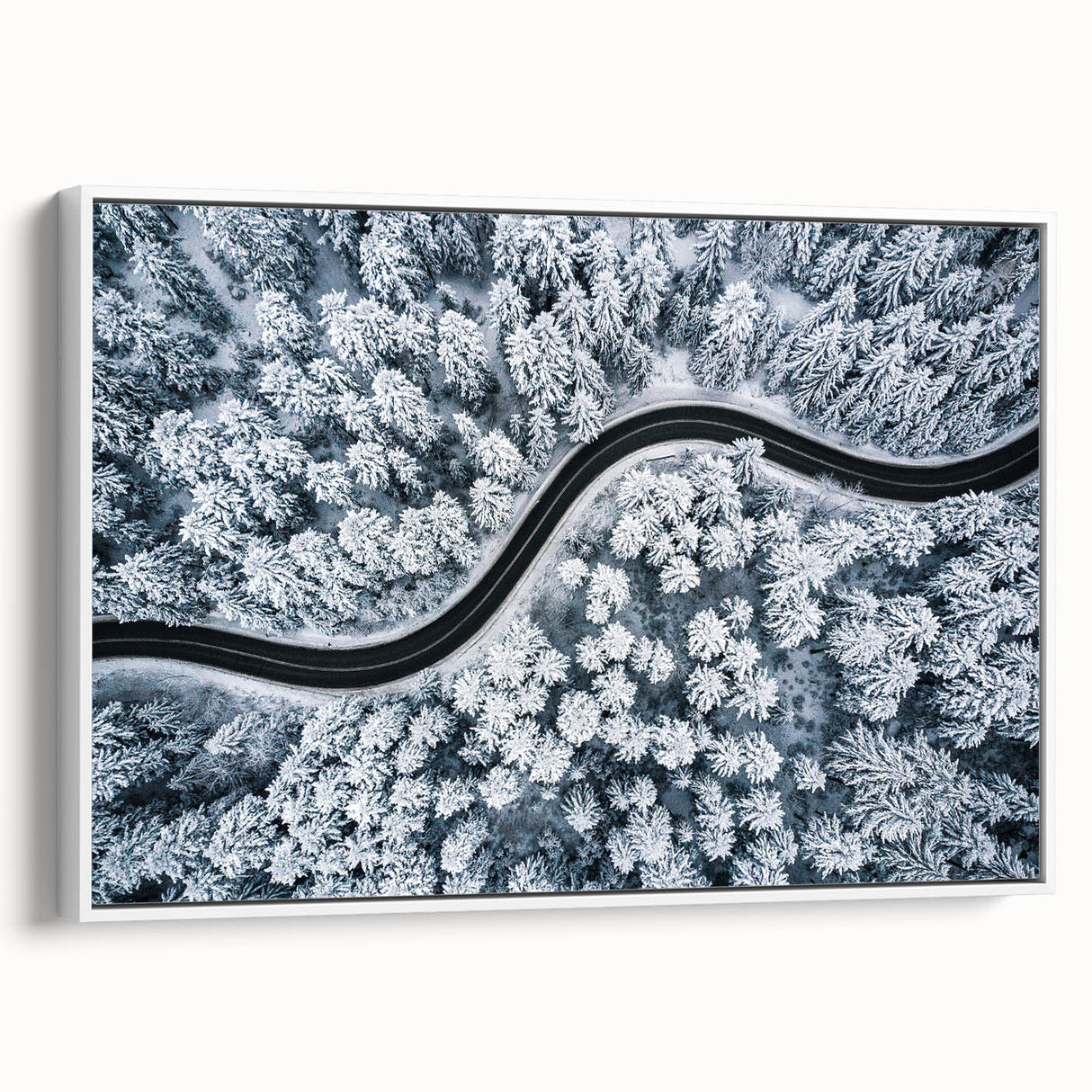 Framed canvas wall art showcasing a serene landscape with winding roads and lush greenery, elegantly presented with a white frame, ideal for home decor.