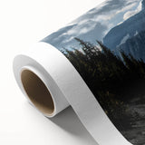 Rolled canvas artwork showcasing a vibrant landscape design featuring winding roads and lush greenery, ideal for home decor. Textured surface enhances visual appeal.