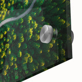 Close-up of a vibrant acrylic glass wall art piece showcasing a scenic landscape with winding roads, enhancing modern decor with its colorful details and artistic flair.