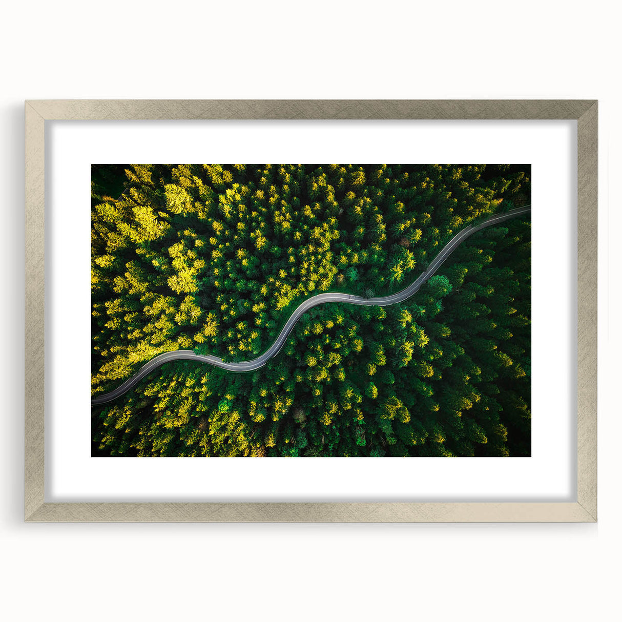 Framed wall art featuring a scenic landscape road design, elegantly displayed in a silver frame with a mat, ideal for home decor or office aesthetics.
