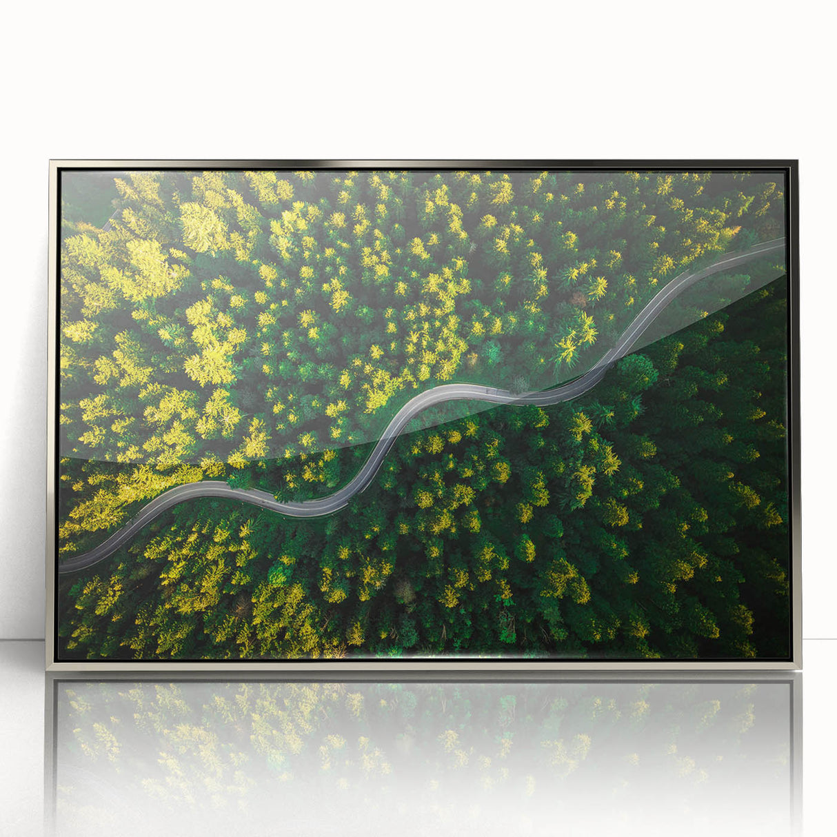Framed wall art featuring a scenic landscape of winding roads, designed in elegant silver accents, perfect for modern home decor. Ideal for enhancing any living space aesthetic.