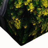 Close-up of a stretched canvas wall art piece featuring a vibrant landscape design with winding roads and lush greenery, ideal for home decor enhancement.