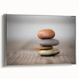 Framed canvas wall art showcasing a serene landscape with textured rocks and earthy tones, featuring a sleek silver frame that enhances modern home decor.