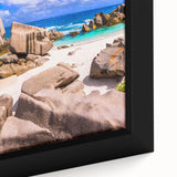 Close-up of a framed canvas wall art piece showcasing a stunning landscape with vibrant rocks and earthy tones, perfect for enhancing home decor and interior aesthetics.