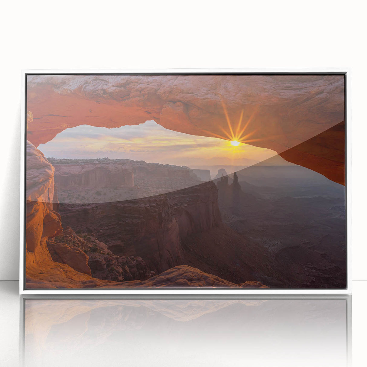 Framed wall art featuring a stunning landscape design with rocky formations, showcased in a sleek white frame, perfect for modern home decor.