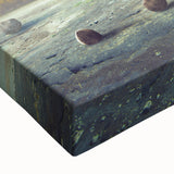 Close-up of a stretched canvas wall art piece showcasing a vibrant landscape with intricate rock formations, ideal for modern home decor and nature enthusiasts.