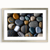 Framed wall art featuring a serene landscape of rocks and natural formations, accented by a silver mat, ideal for modern home decor and interior design.