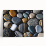 Stretched canvas wall art featuring a modern landscape design with colorful rock formations, leaning against a neutral wall, perfect for home decor and artistic expression.