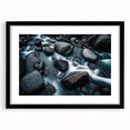 Framed wall art collection showcasing a serene landscape with textured rocks, featuring a sleek black frame and mat, ideal for home decor enhancement.