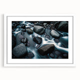 Framed wall art featuring a serene landscape design with rocky formations and soft colors, set in a sleek white mat and frame, ideal for home decor.