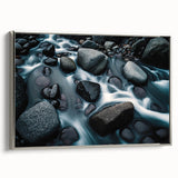 Framed canvas wall art showcasing a serene landscape with rocky formations, featuring a silver frame. Ideal for modern home decor, enhancing aesthetic appeal.