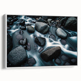 Framed canvas wall art showcasing a serene landscape with rocks, featuring soft earthy tones and a minimalist design, ideal for modern home decor.