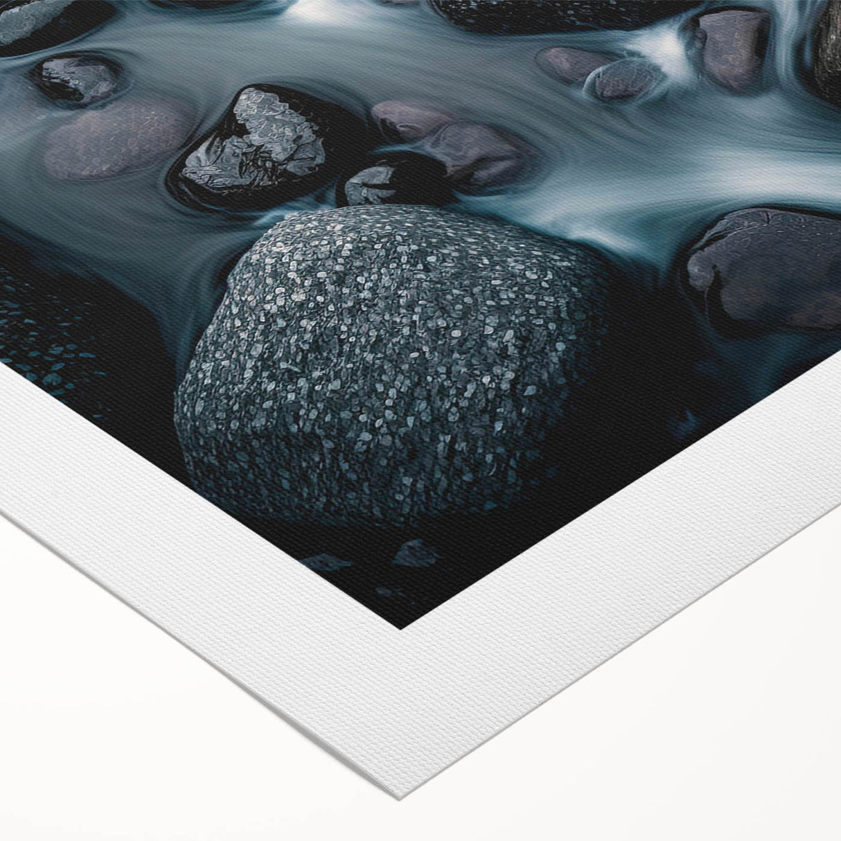 Rolled canvas artwork showcasing a serene landscape with textured rocks and vibrant hues, ideal for home decor, packaged securely in a protective tube.