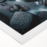 Rolled canvas artwork showcasing a serene landscape with textured rocks and vibrant hues, ideal for home decor, packaged securely in a protective tube.