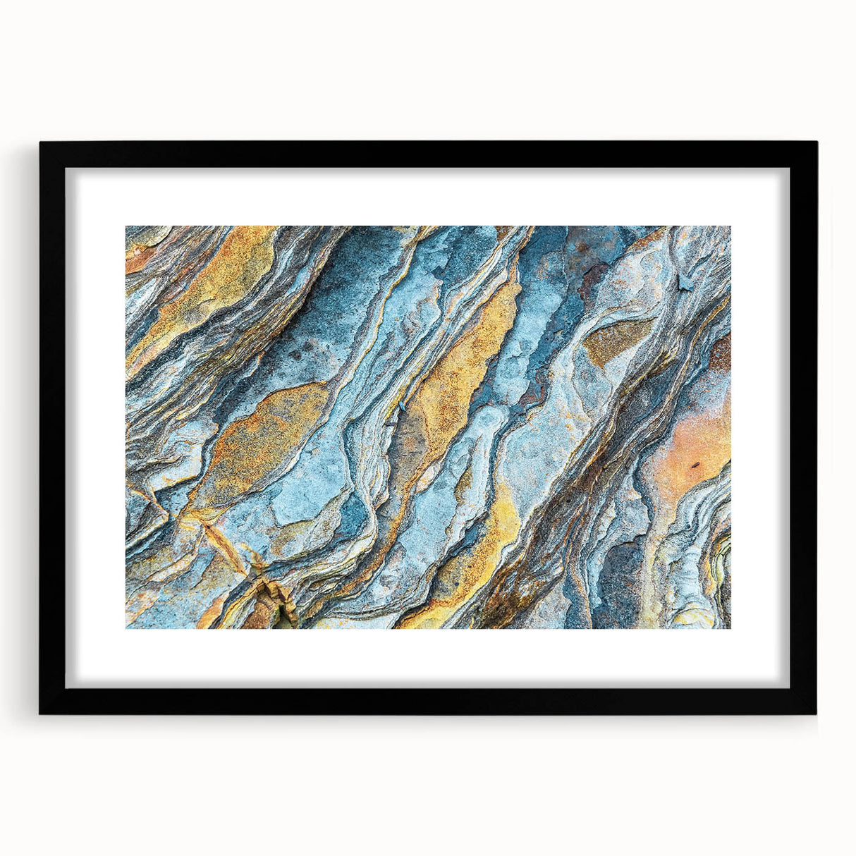 Framed wall art showcasing a scenic landscape with rocks, featuring a black mat and elegant frame, ideal for home decor. Perfect for nature enthusiasts.