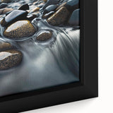 Close-up of a framed canvas artwork showcasing a stunning landscape design with intricate rocks and natural textures, perfect for enhancing home decor.