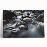 Stretched canvas wall art showcasing a serene landscape with rugged rocks and soft earth tones, leaning against a neutral wall, perfect for home décor.