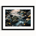Framed wall art featuring a striking landscape design with rocky formations, set in a sleek black frame with a white mat, perfect for modern home decor.