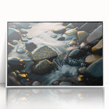 Framed acrylic wall art showcasing a serene landscape with rocks and vibrant colors, perfect for modern home decor. The white frame enhances the scenic design.