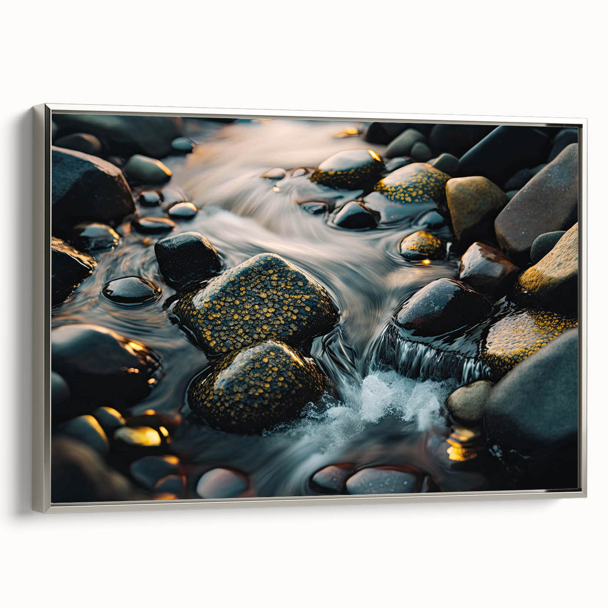 Framed canvas wall art featuring a serene landscape with textured rocks, set in a sleek silver frame, perfect for modern home decor. Ideal for nature enthusiasts.