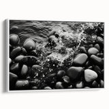Framed canvas wall art showcasing a serene landscape with rocks and soft hues, featuring a sleek white frame that enhances its modern aesthetic. Ideal for home decor.