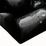 Close-up of a vibrant stretched canvas featuring a textured landscape design with colorful rocks, ideal for home decor and wall art enthusiasts.