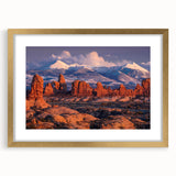 Framed wall art featuring a stunning landscape design with rocks, presented in a gold frame with a mat, perfect for enhancing home decor aesthetics.