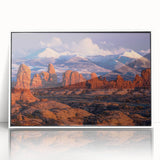 Framed acrylic wall art showcasing a serene landscape with rocky formations, featuring calming earth tones and a sleek white frame, ideal for modern decor.