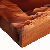 Close-up of a stretched canvas wall art piece showcasing a vibrant landscape with intricate rock formations, perfect for home decor and modern interior design.