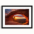 Framed wall art featuring a serene landscape with rocks and natural elements, displayed in a sleek black frame with a mat, perfect for home decor enhancement.