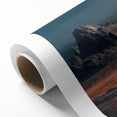 Rolled canvas artwork showcasing a serene landscape featuring textured gray and brown rocks, ideal for modern home decor, packaged securely in a cardboard tube.