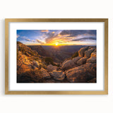 Framed wall art showcasing a serene landscape with layered rocks and soft colors, accented by a gold mat, perfect for enhancing modern home decor aesthetics.