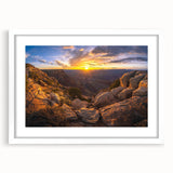 Framed wall art featuring a serene landscape of rocks and natural elements, showcased with a white matting that enhances the overall aesthetic appeal, ideal for home decor.