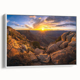 Framed canvas wall art showcasing a serene landscape with textured rocks, featuring a white frame that enhances the earthy tones, perfect for modern home decor.