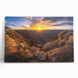 Stretched canvas wall art featuring a serene landscape with intricate rock formations, showcasing earthy tones of brown and green, ideal for home décor.