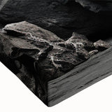 Close-up of a stretched canvas wall art piece showcasing an intricate landscape design featuring rocks and natural textures, perfect for home decor.