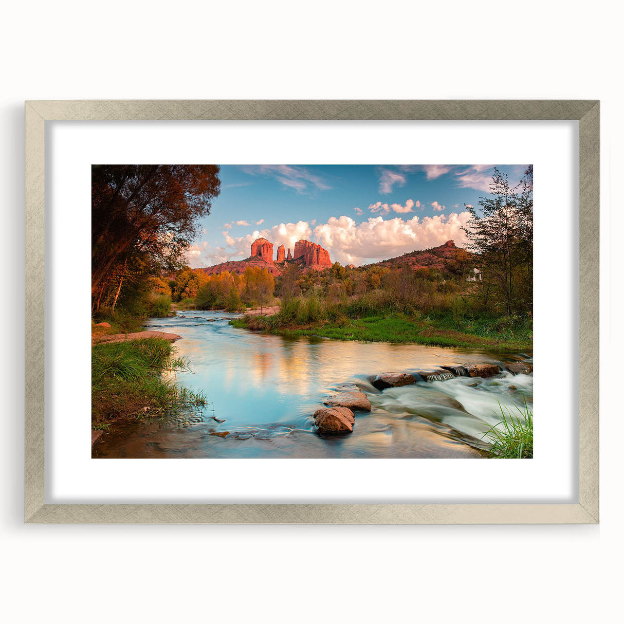 Framed wall art featuring a serene landscape design with textured rocks and earthy tones, elegantly showcased in a silver frame with a mat, perfect for home decor.