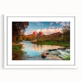 Framed wall art showcasing a serene landscape with rocks and greenery, featuring a white mat and sleek frame, ideal for home decor enthusiasts seeking nature-inspired designs.